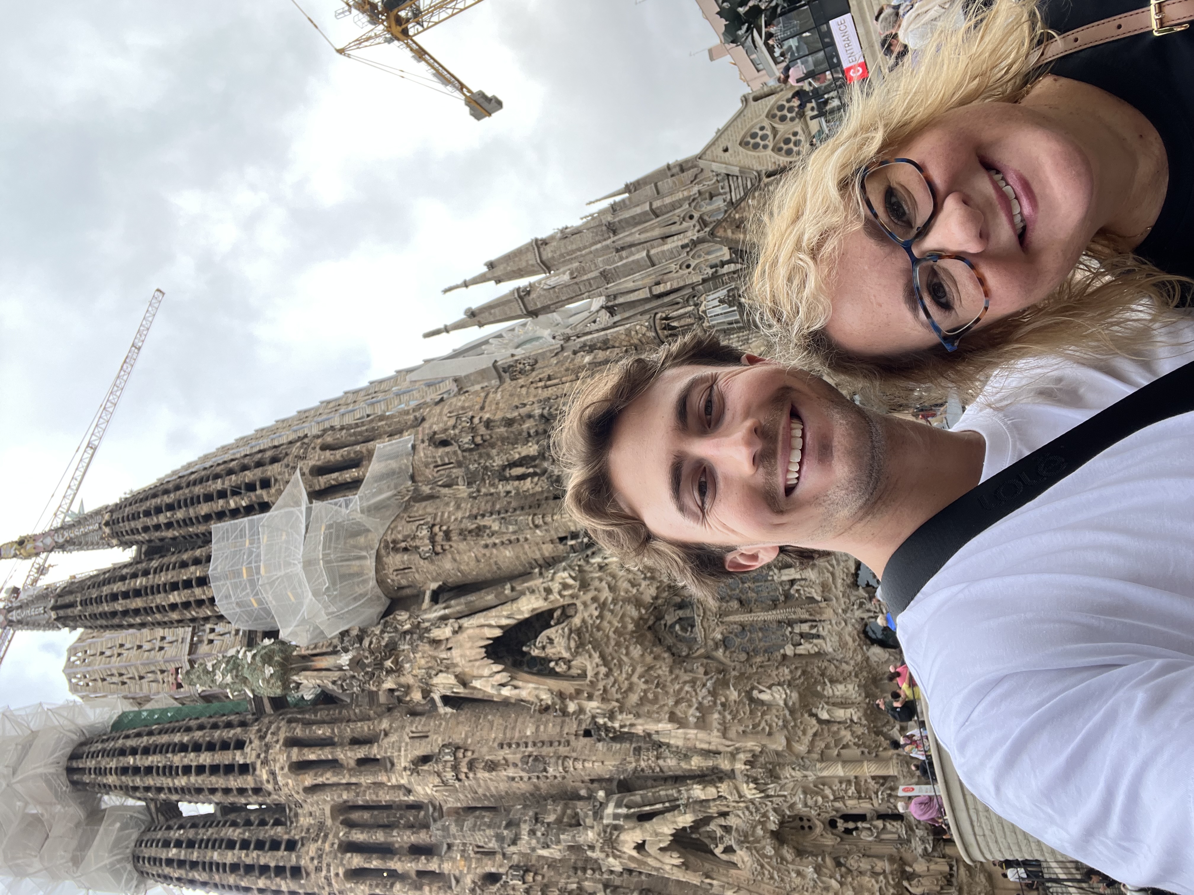 Julian taking a picture in front of the Sagrada Familia with his mom